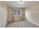 Neutral bedroom with carpet flooring, a window and white trim at 160 Coastal Pier Ct, Henderson, NV 89002