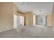 Large carpeted bedroom boasts a ceiling fan, walk-in closet, recessed lighting and access to backyard through glass paneled doors at 160 Coastal Pier Ct, Henderson, NV 89002