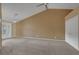 Spacious bedroom featuring carpet, ceiling fan, and access to the backyard at 160 Coastal Pier Ct, Henderson, NV 89002