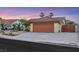 Charming single-story home with a desert landscape, a two-car garage, and a tile roof at 160 Coastal Pier Ct, Henderson, NV 89002