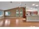 Spacious living room with hardwood floors, vaulted ceilings, and a kitchen bar top view at 160 Coastal Pier Ct, Henderson, NV 89002