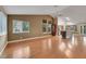 Open living room with hardwood floors, vaulted ceilings, and bright windows providing great natural light at 160 Coastal Pier Ct, Henderson, NV 89002