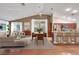Spacious, virtually staged living area featuring an open floor plan and hardwood flooring at 160 Coastal Pier Ct, Henderson, NV 89002