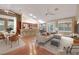 Beautifully staged open-concept living and kitchen area with hardwood floors at 160 Coastal Pier Ct, Henderson, NV 89002
