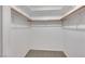 Walk-in closet with carpet and built-in shelving at 160 Coastal Pier Ct, Henderson, NV 89002