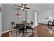 Cozy dining area with a modern table, four chairs, a ceiling fan and laminate floors at 2451 N Rainbow Blvd # 2043, Las Vegas, NV 89108