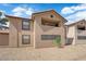 Neutral stucco condominium building featuring dark trim windows and spacious balcony at 2451 N Rainbow Blvd # 2043, Las Vegas, NV 89108