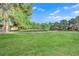 Expansive and well-manicured green space with mature trees and nearby buildings at 2451 N Rainbow Blvd # 2043, Las Vegas, NV 89108