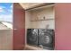Convenient laundry closet includes a side-by-side washer and dryer, plus storage shelf at 2451 N Rainbow Blvd # 2043, Las Vegas, NV 89108