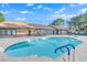 A well maintained residential pool with a clear blue water under a partly cloudy sky at 2451 N Rainbow Blvd # 2043, Las Vegas, NV 89108