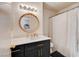 Charming bathroom with a decorative gold mirror, white counter, and black vanity with gold pulls at 3322 Dragon Fly St, North Las Vegas, NV 89032
