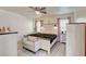 Bright bedroom showcasing a ceiling fan, dresser, and large bed at 3322 Dragon Fly St, North Las Vegas, NV 89032