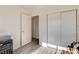 Neutral bedroom with modern wood flooring, bright natural light, and closet at 3322 Dragon Fly St, North Las Vegas, NV 89032