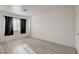 Bright bedroom featuring modern gray wood flooring and an abundance of natural light at 3322 Dragon Fly St, North Las Vegas, NV 89032