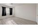 Bedroom with light wood floors and black out curtains at 3322 Dragon Fly St, North Las Vegas, NV 89032
