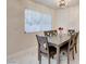 Comfortable dining area with a wood table, seating for six, and a window for natural light at 3322 Dragon Fly St, North Las Vegas, NV 89032