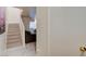 Home entryway featuring modern stairwell, leading into adjacent living area with abundant natural light at 3322 Dragon Fly St, North Las Vegas, NV 89032