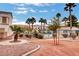 Well-maintained landscaping with lush bushes and tall palm trees, surrounding a community pool at 3322 Dragon Fly St, North Las Vegas, NV 89032