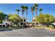 Exterior of buildings with well-manicured lawns and mature palm trees along the parking area at 3322 Dragon Fly St, North Las Vegas, NV 89032