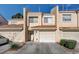 Charming townhome with well-maintained landscaping, private garage, and inviting entryway at 3322 Dragon Fly St, North Las Vegas, NV 89032