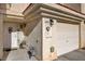 Charming home exterior with a welcoming front door and a convenient attached garage at 3322 Dragon Fly St, North Las Vegas, NV 89032
