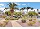 Lush landscaping surrounds the building, featuring palm trees and well-maintained shrubs at 3322 Dragon Fly St, North Las Vegas, NV 89032