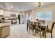 Bright kitchen and dining area with stainless steel appliances and modern fixtures at 3322 Dragon Fly St, North Las Vegas, NV 89032