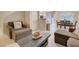 Inviting living room with plush seating, decorative pillows, and a stylish coffee table, creating a cozy atmosphere at 3322 Dragon Fly St, North Las Vegas, NV 89032