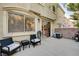 This patio includes seating and an air conditioning unit at 3322 Dragon Fly St, North Las Vegas, NV 89032