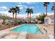 Community pool with lounge chairs and palm trees offering a relaxing outdoor space at 3322 Dragon Fly St, North Las Vegas, NV 89032