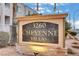 Community signage for 3260 Cheyenne Villas featuring stone accents and well-maintained landscaping at 3322 Dragon Fly St, North Las Vegas, NV 89032