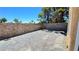 Spacious backyard features stone walls and brick patio at 3412 Adventure Ct, Las Vegas, NV 89129