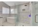 Modern bathroom boasts a soaking tub, walk-in glass shower with rainfall shower head and tiled walls at 3412 Adventure Ct, Las Vegas, NV 89129