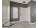 Welcoming entryway with modern flooring, a stylish table, and neutral tones creating an inviting atmosphere at 3412 Adventure Ct, Las Vegas, NV 89129