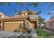 Charming two-story home featuring a large two-car garage and tile roof at 3412 Adventure Ct, Las Vegas, NV 89129