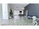 Spacious living room with sleek furniture, modern decor, and ample natural light from large windows at 3412 Adventure Ct, Las Vegas, NV 89129