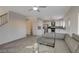 Bright living space showcasing tile floors that flow into a modern kitchen with stainless steel appliances at 3412 Adventure Ct, Las Vegas, NV 89129