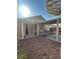 Backyard patio area with gravel, concrete, and a covered seating area at 3416 Mountain Park St, Las Vegas, NV 89129