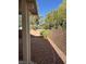 View of backyard featuring a covered patio, an enclosed fence, and mature landscaping at 3416 Mountain Park St, Las Vegas, NV 89129