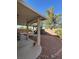 The covered patio offers a comfortable space and easy-care rock landscape for outdoor relaxation at 3416 Mountain Park St, Las Vegas, NV 89129