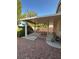 Backyard with a covered patio area, gravel, concrete slabs and a perimeter wall at 3416 Mountain Park St, Las Vegas, NV 89129
