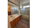 Bathroom featuring a double vanity with a shower-tub combo and natural light for a refreshing ambiance at 3416 Mountain Park St, Las Vegas, NV 89129