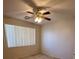 Bright bedroom featuring neutral colored carpet and a ceiling fan with a light fixture at 3416 Mountain Park St, Las Vegas, NV 89129