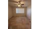 A bedroom with a ceiling fan and tile floors with a bright window at 3416 Mountain Park St, Las Vegas, NV 89129