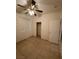 A bedroom with a ceiling fan, tiled floors, a bright window, and a closet at 3416 Mountain Park St, Las Vegas, NV 89129
