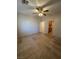 This bedroom features neutral tile floors, a ceiling fan, and a closet/storage area at 3416 Mountain Park St, Las Vegas, NV 89129