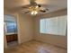 This bright bedroom has a ceiling fan and an attached bathroom with a tiled floor at 3416 Mountain Park St, Las Vegas, NV 89129