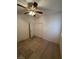 A bedroom with a ceiling fan, tiled floors, a bright window, and a closet at 3416 Mountain Park St, Las Vegas, NV 89129