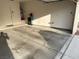 Clean garage with a side door, water filtration system, and concrete flooring at 3416 Mountain Park St, Las Vegas, NV 89129