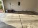 Spacious garage with concrete flooring and a roll-up door for secure parking at 3416 Mountain Park St, Las Vegas, NV 89129